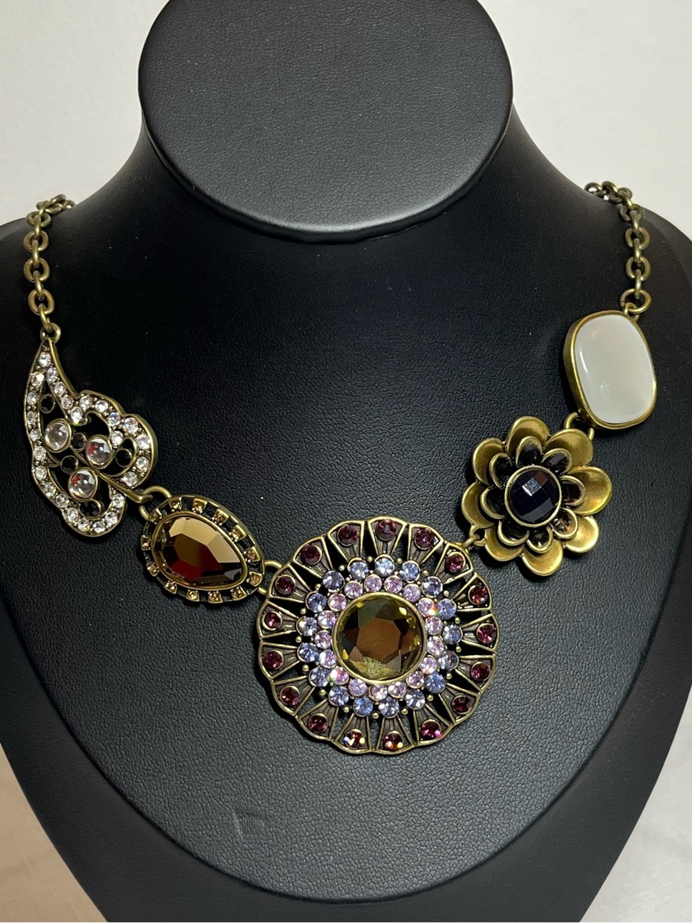 Floral & Medallion Necklace in Gold with Amber and White Accents
Bold
Statement